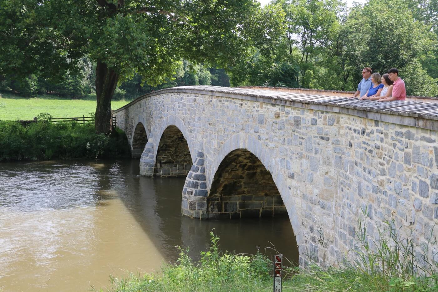 men riding horse on green grass field during daytime