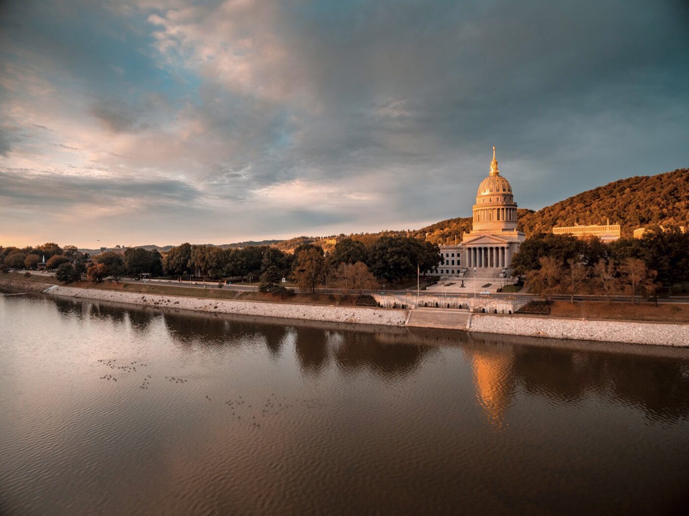 men riding horse on green grass field during daytime